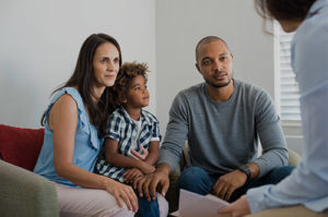 Woman, child and man receiving counseling